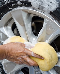 Person washing a wheel