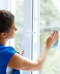 Woman cleaning a window